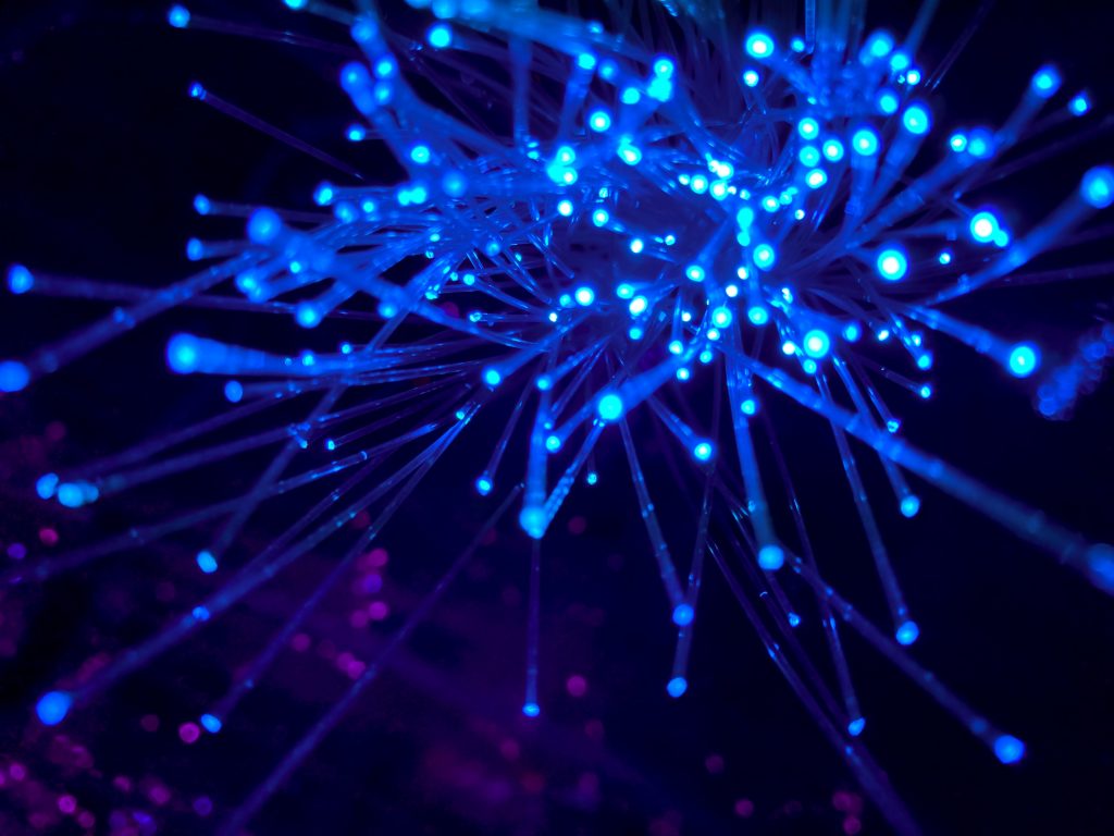 a blockchain technology network with lines of blue light that resemble the metaverse